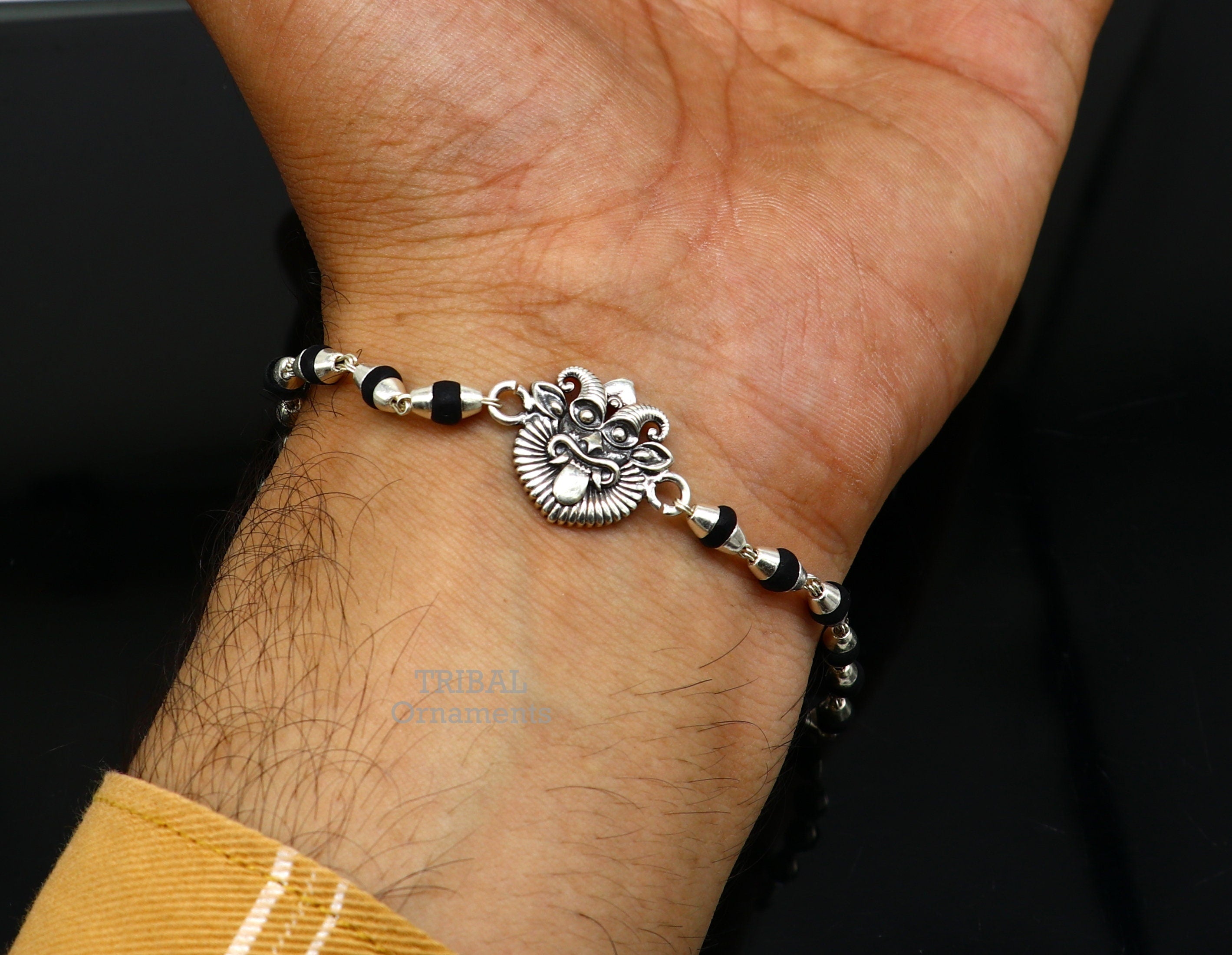 Sterling silver bracelet with pear-shaped natural stones.